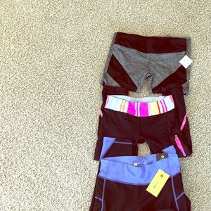 Lot of workout capris. Under armor, lululemon.